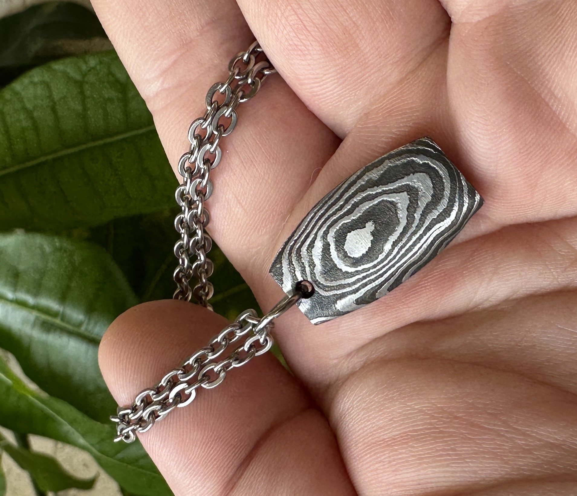 ovular damascus steel pendant